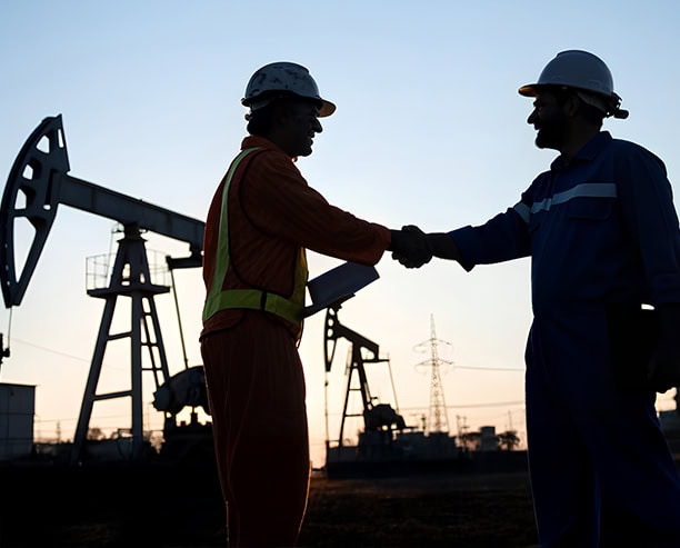 Oilfield Workers Handshake Deal Agreement
