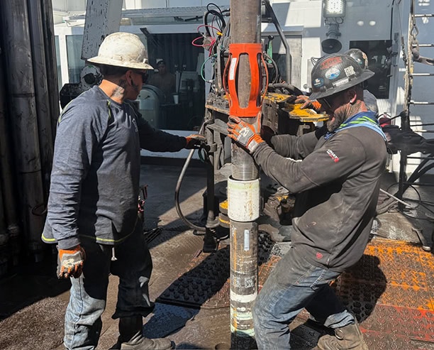 Oil Rig Workers Operating Drilling Equipment